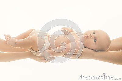 Little kid with nappy in fathers and mothers hands. Stock Photo