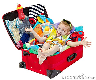 Little kid in travel suitcase packed for vacation Stock Photo