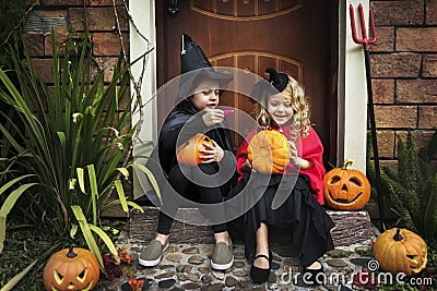 Little kids at a Halloween party Stock Photo