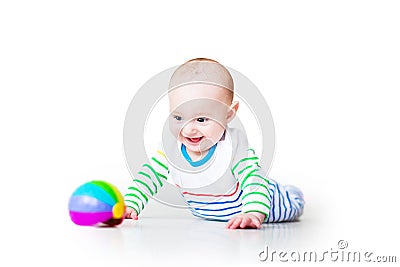 Little laughing funny baby boy learning to crawl Stock Photo