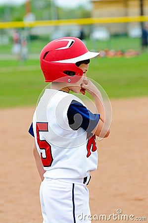 Little league player on base. Stock Photo