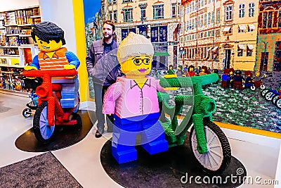 Little Lego men in human scale made of a lot of Lego bricks in Copenhagen, Denmark Editorial Stock Photo