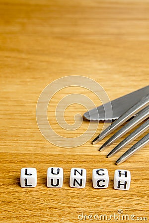 Little miniature figurines with little dices forming word lunch as a part of team meeting collection pictures Stock Photo