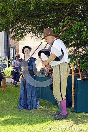 Little Moreton Hall Tudor musicians playing bagpipes Editorial Stock Photo