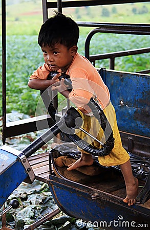 Little Myanmar child on a small truck Editorial Stock Photo