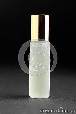 Little parfume bottle on black background Stock Photo