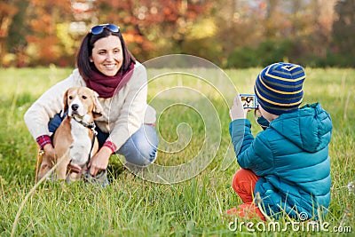 Little photographer - happy family moment Stock Photo