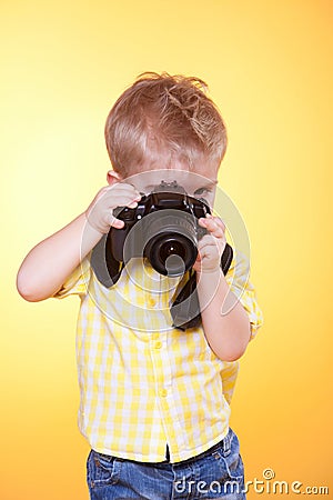 Little photographer shooting professional camera Stock Photo