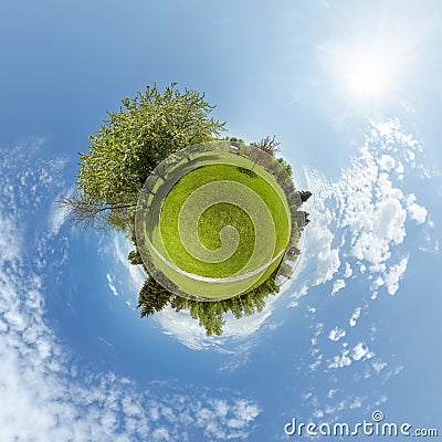 Little planet with trees and green meadow Stock Photo