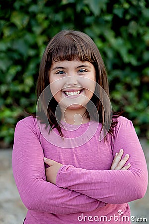 Little preteen girl in park Stock Photo