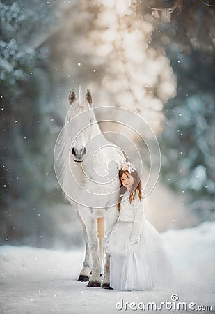 The little princess with an unicorn in the forest. Stock Photo