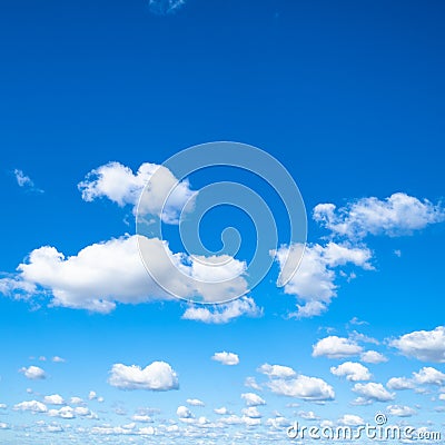 Little puffy clouds in blue sky in sunny day Stock Photo