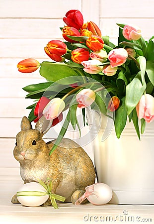 Little rabbit behind white container Stock Photo