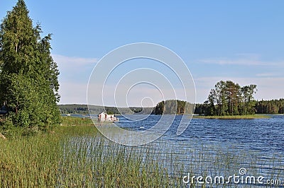 A little red cottage on a dock Stock Photo