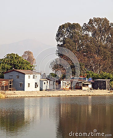 Little rural houses over water, Nam Sang Wai, HK Stock Photo