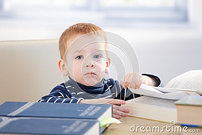 Little scholar with encyclopedia Stock Photo