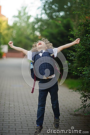 Little schoolboy as if flying. Stock Photo