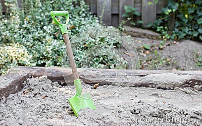 Little shovel in the sand Stock Photo