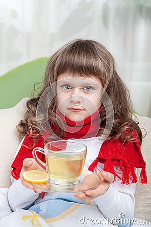 Little sick girl in bed is taking medicine Stock Photo