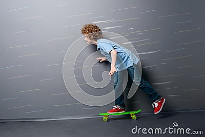 Little skateboarder is gaining speed Stock Photo