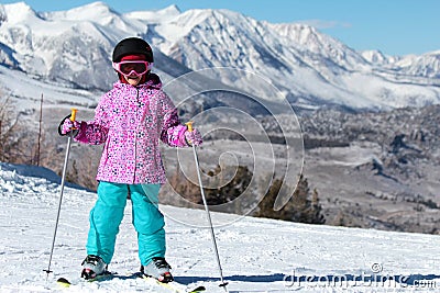 Little Skier girl on a mountain ski Stock Photo