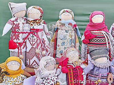 Little slavic folk rag dolls - mascots associated with heathen traditions. Handmade gifts on fair. Stock Photo