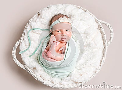 Little smiling baby in basket, top view Stock Photo