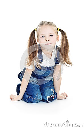 Little smiling girl in blue jeans Stock Photo