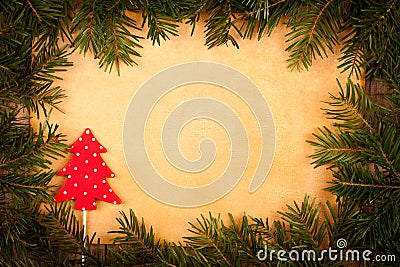 Little spotted Christmas tree with old paper and branch Stock Photo