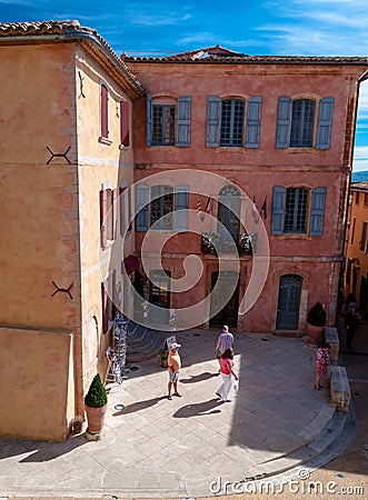 Little square and buildings in Roussillon village in France Editorial Stock Photo