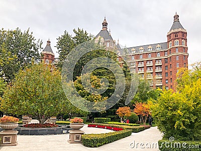 Little square in Tianjin city with little park and The 5 star hotel The Ritz Carlton Editorial Stock Photo