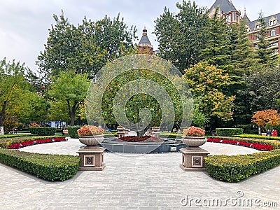 Little square in Tianjin city with little park and The 5 star hotel The Ritz Carlton Editorial Stock Photo