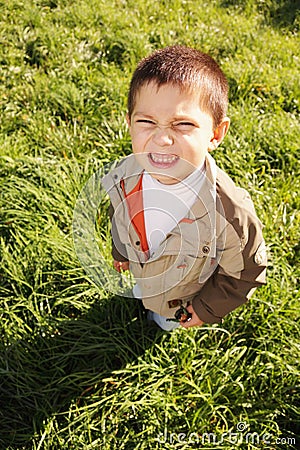 Little squinting boy Stock Photo