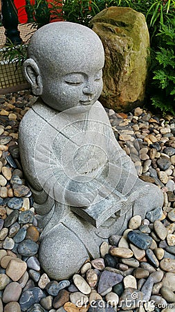 Little Stone Monk (Reading) Stock Photo