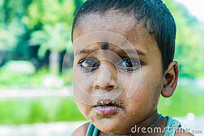 Little street boy from Indian ethnicity staring Editorial Stock Photo