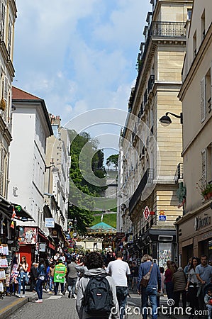 Little street with bunch of people walking on it Editorial Stock Photo