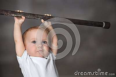 Little strong baby toddler playing sports. Kid during his workout. Success and winner concept Stock Photo