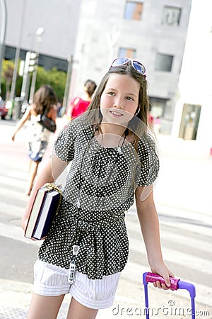 Little student girl going to school in city Stock Photo