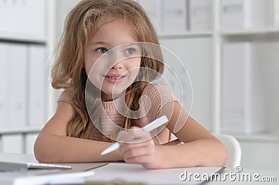 little student girl making homework Stock Photo