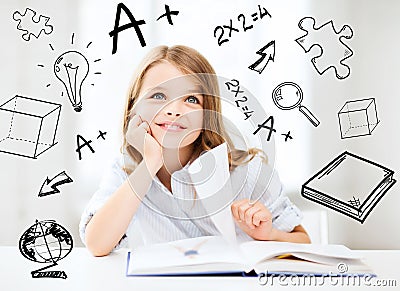 Little student girl studying at school Stock Photo