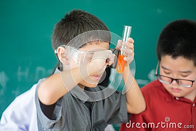 Little students study science in classroom Stock Photo