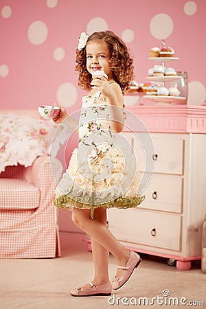 Little sweet girl with tea Stock Photo