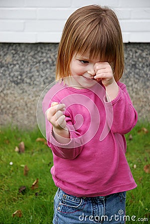 Little toddler girl is ashamed Stock Photo