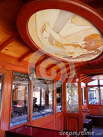 Little tourist train in Abreschviller. Art deco interior decoration of the Orient Express wagon. Editorial Stock Photo