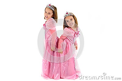 Little Twin Girls are dressed as princess in pink Stock Photo