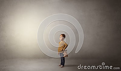 Little waggish kid in an empty room Stock Photo