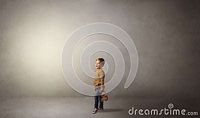 Little waggish kid in an empty room Stock Photo