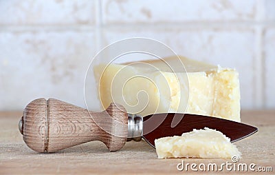 A little wedge of parmigiano cheese, with knife Stock Photo