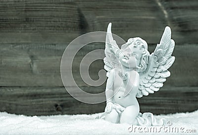 Little white angel in snow. Christmas decoration Stock Photo