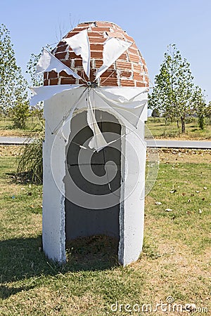 Little windmill on Greek countryside Stock Photo
